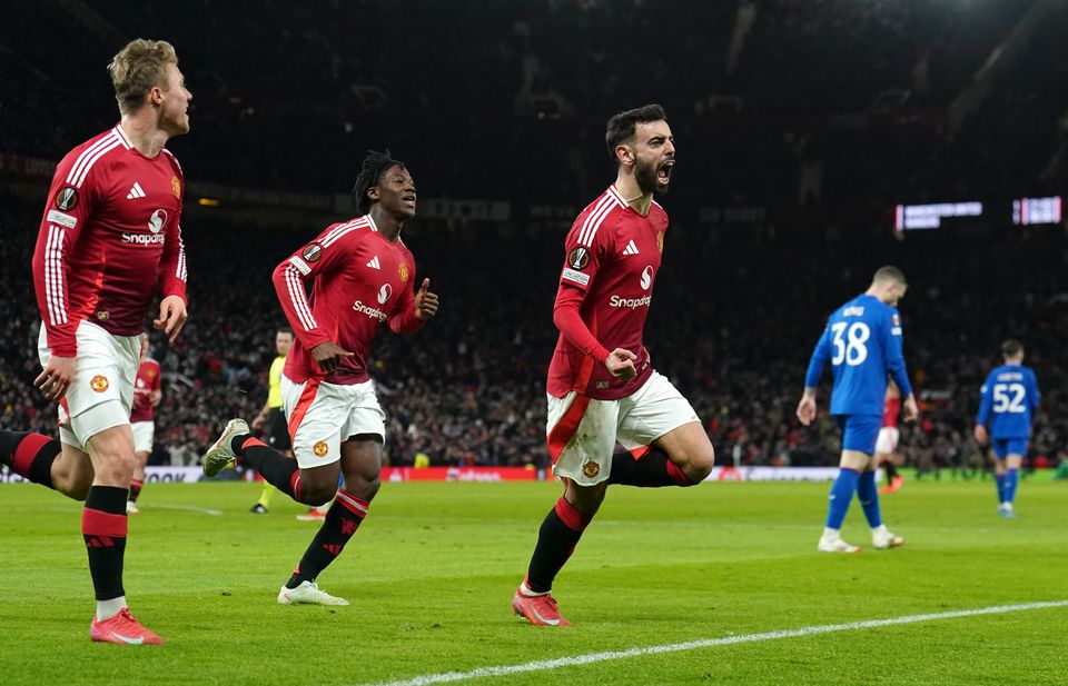 Bruno Fernandes (right) struck in stoppahe time to give Manchester United victory over Rangers at Old Trafford (Martin Rickett/PA)