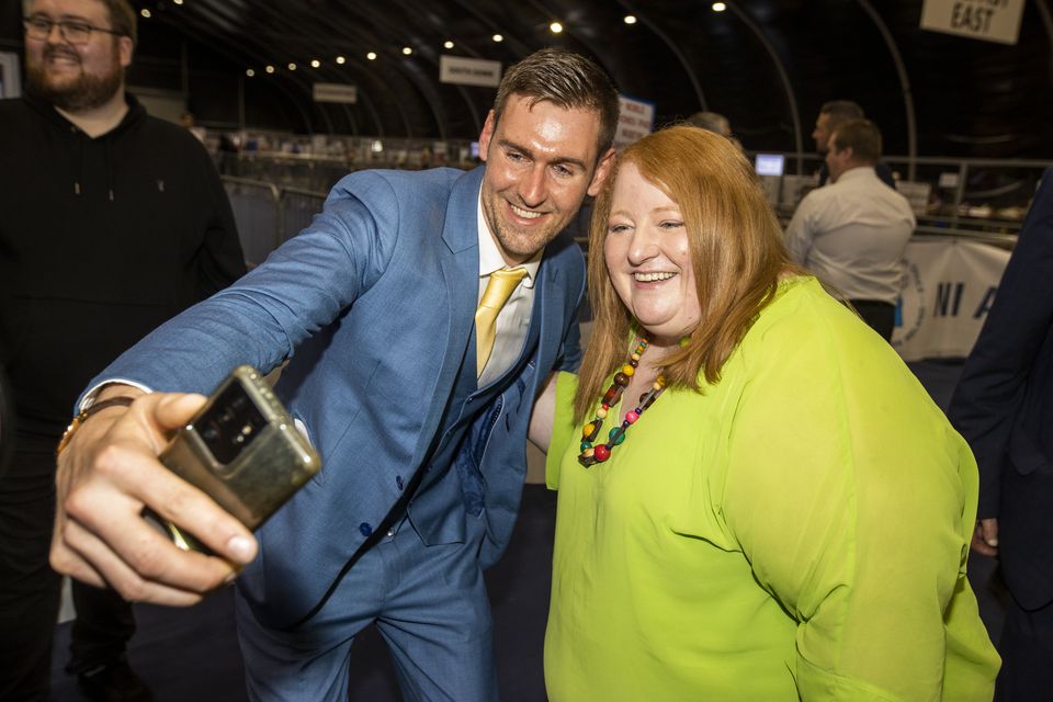 Patrick Brown with Alliance Party leader Naomi Long at an election count in Belfast in 2022 (PA)