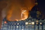 thumbnail: The Taj Hotel, Mumbai's landmark hotel, is caught fire after an attack in Mumbai, India's financial capital, on early Thursday morning November 27, 2008. Teams of heavily armed gunmen stormed luxury hotels, a popular restaurant, hospitals and a crowded train station in coordinated attacks across India's financial capital Wednesday night, killing at least 78 people and taking Westerners hostage, police said. (AP Photo)