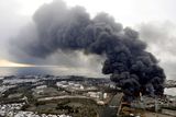 thumbnail: Black smoke rises from burning buildings in a factory zone in Sendai, Miyagi Prefecture, Saturday morning, March 12, 2011 after Japan's biggest recorded earthquake slammed into its eastern coast Friday