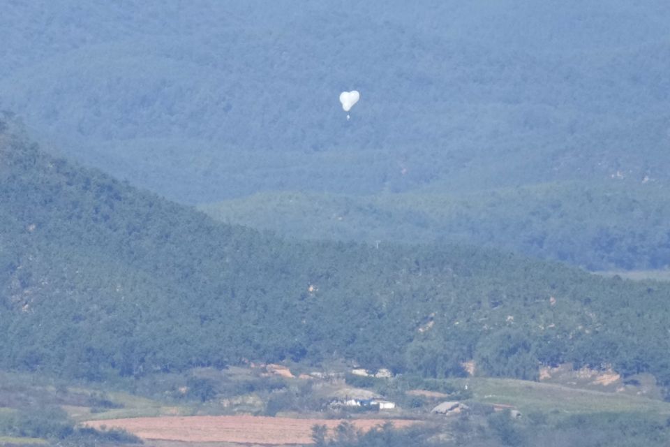 North Korean balloons are seen from the Unification Observation Post in Paju, South Korea (AP)