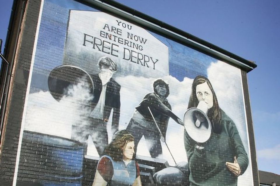 A Republican mural is seen on the side of a house in the Bogside are of Derry, the scene of the 'Bloody Sunday' shootings. 2005