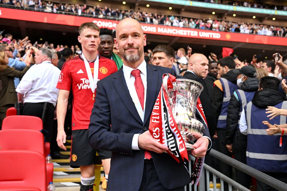 Erik ten Hag holds the FA Cup after Manchester United's final victory over Manchester City