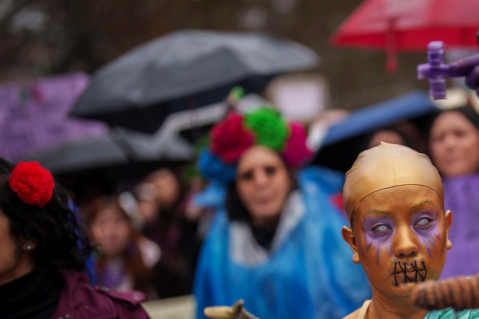 Demonstrators take to the streets of Madrid to call for equality and justice (Bernat Armangue/AP)