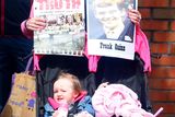 thumbnail: Protestors await the arrival of Prince Charles and Camilla at St Patrick's Church, Donegall Street, Belfast.