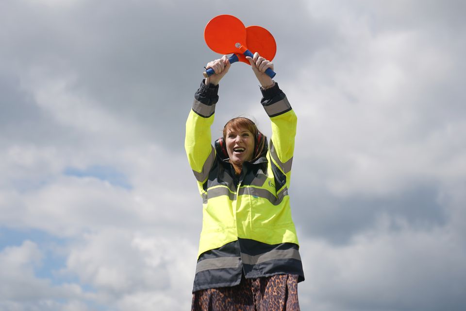 Labour’s Angela Rayner attempting to marshal in a new government during a visit to Stansted Airport (Joe Giddens/PA)