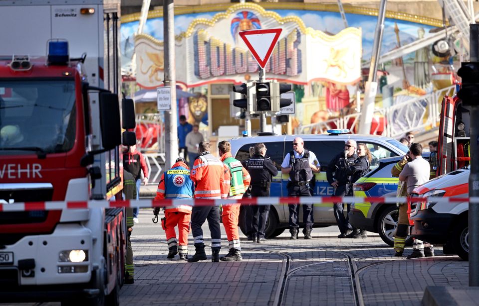 Police and emergency services in the centre of Mannheim (Boris Roessler/dpa via AP)