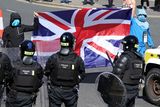 thumbnail: Police and anti-immigration protesters in a stand-off in Belfast on Saturday