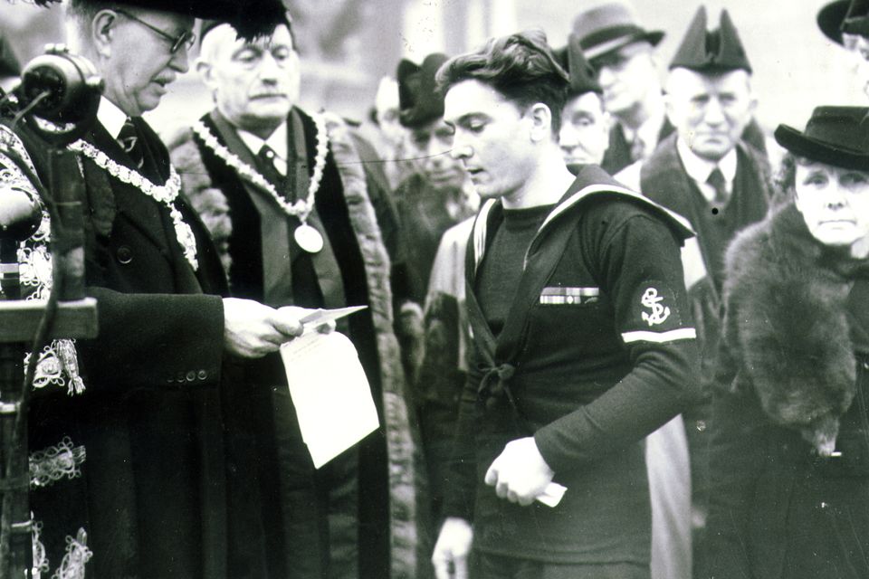 James Magennis:Ulsterman awarded The Victoria Cross (VC). Belfastman decorated for his heroic actions onboard the X.E.11 Midget Submarine returning from the attack on a japanese cruiser. James Magennis with Lord Mayor Sir Crawford McCullagh at a civic reception in Belfast in 1945.