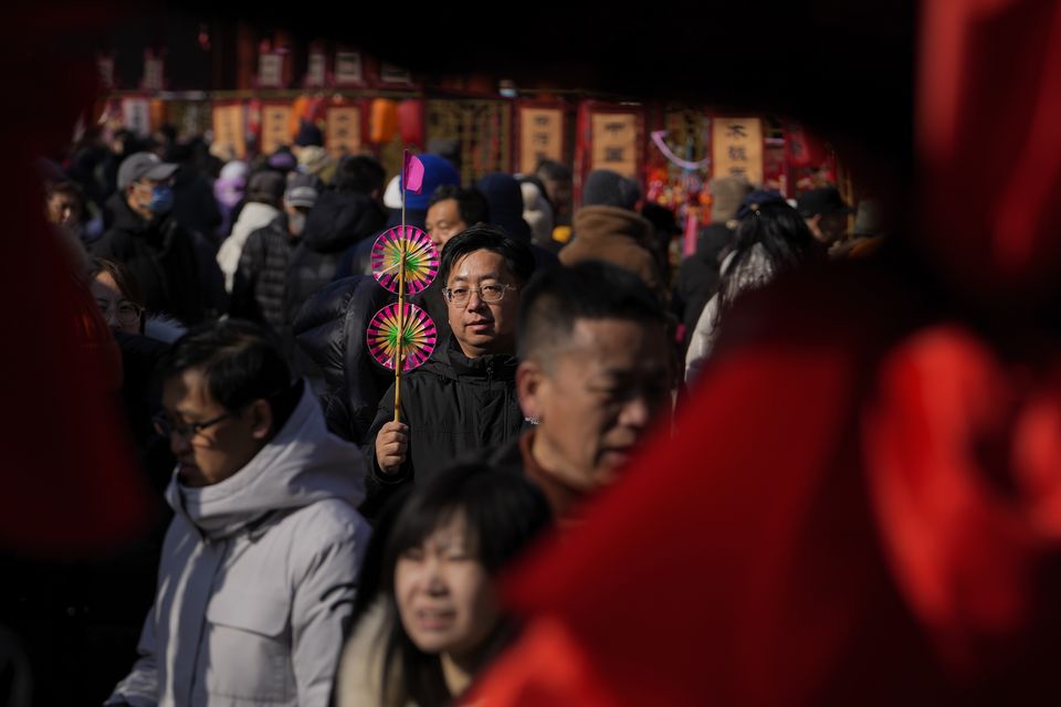 Many Chinese people take advantage of the extended holiday to travel both in their own country and abroad (AP)