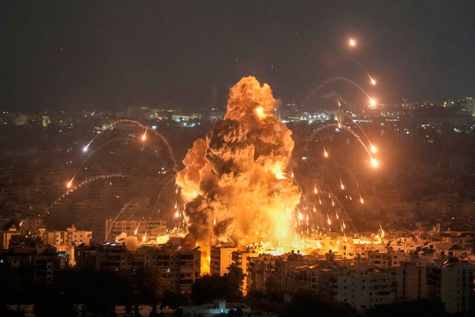 Flames and smoke rise from an Israeli airstrike in Dahiyeh, Beirut, last night. Photo: AP