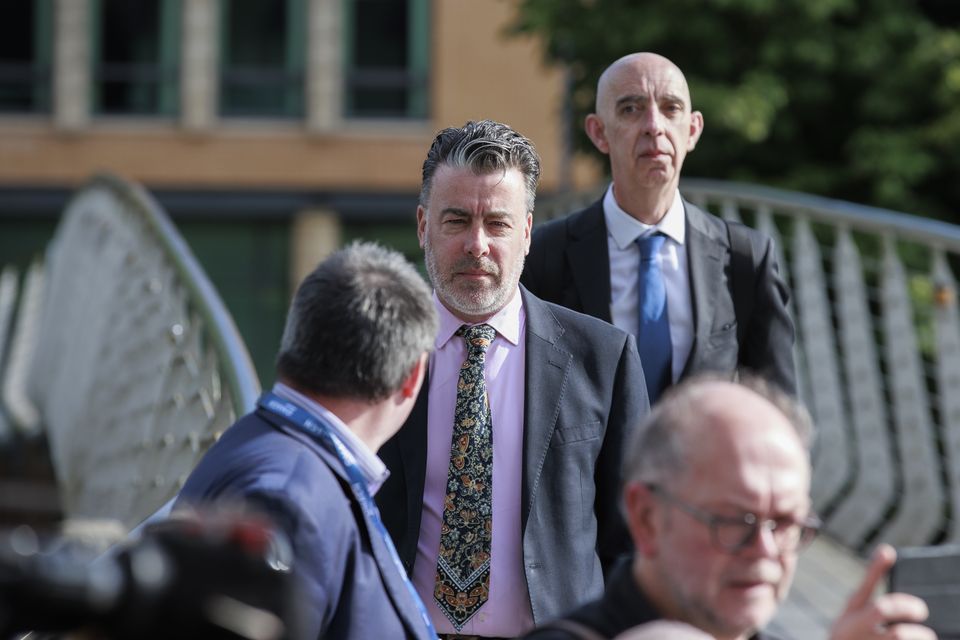 Ruairi de Burca (centre), senior official with Ireland’s Department of Foreign Affairs, arriving at the Strule Arts Centre in Omagh (Liam McBurney/PA)