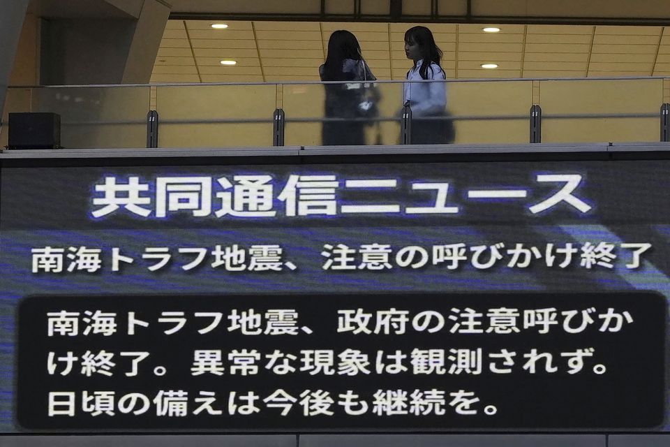 A monitor shows a message that Japan’s government announced the end of its week-long drive for increased caution and preparedness for a possible megaquake (Kyodo News via AP/PA)