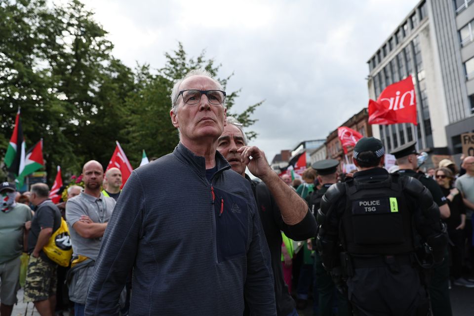 Sinn Fein's Gerry Kelly shows his support for migrants