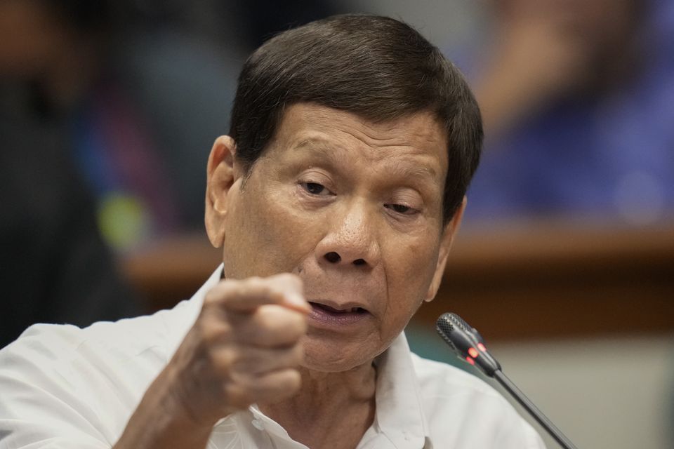 Mr Duterte was arrested on Tuesday after he arrived at Manila’s Ninoy Aquino International Airport  (Aaron Favila/AP)