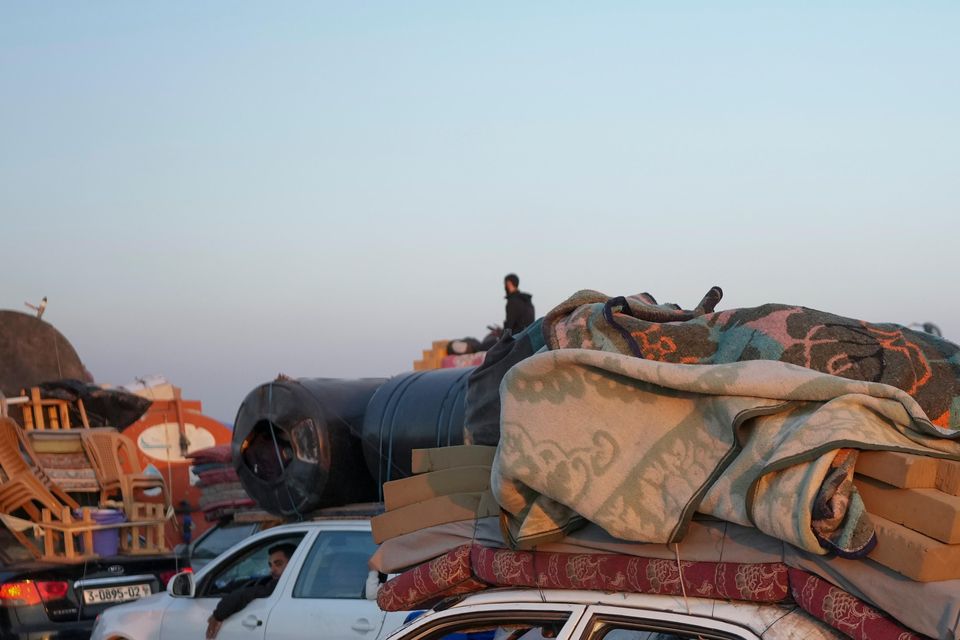 Displaced Palestinians make their way from central Gaza to their homes in the northern Gaza Strip (AP Photo/Abdel Kareem Hana)