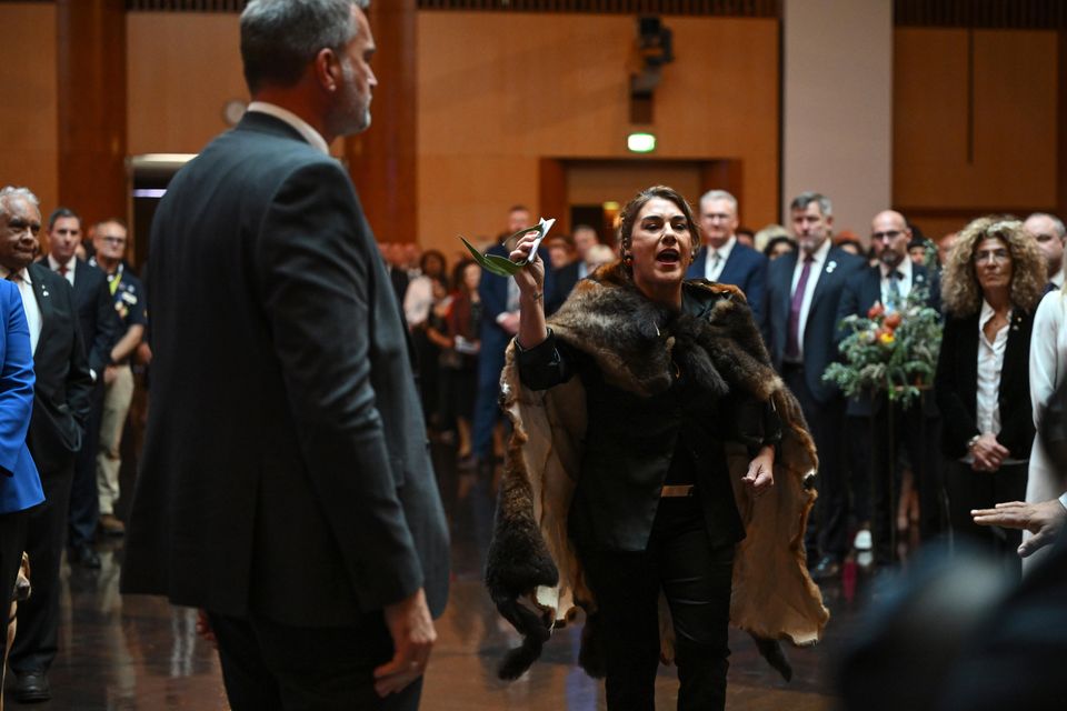 Australian senator Lidia Thorpe protests during the ceremonial welcome in Canberra for the King and Queen (Victoria Jones/PA)