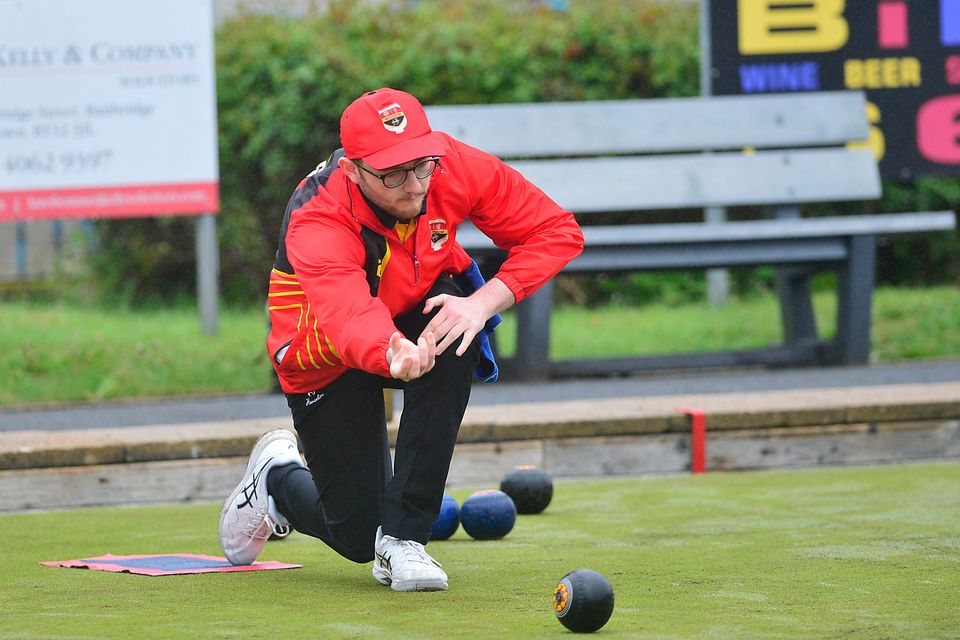 Alex Cromie delivers a bowl for Banbridge in their clash with Bessbrook