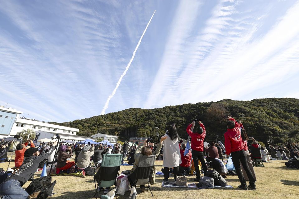 People watch Space One’s Kairos No 2 rocket launch (Kyodo News/AP)