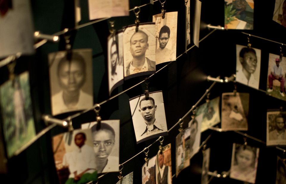 Family photographs of some of those who died hang in a display in the Kigali Genocide Memorial Centre in Kigali, Rwanda (AP Photo/Ben Curtis, File)