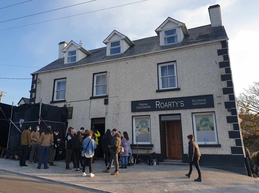 The crew outside Roarty's pub in the village