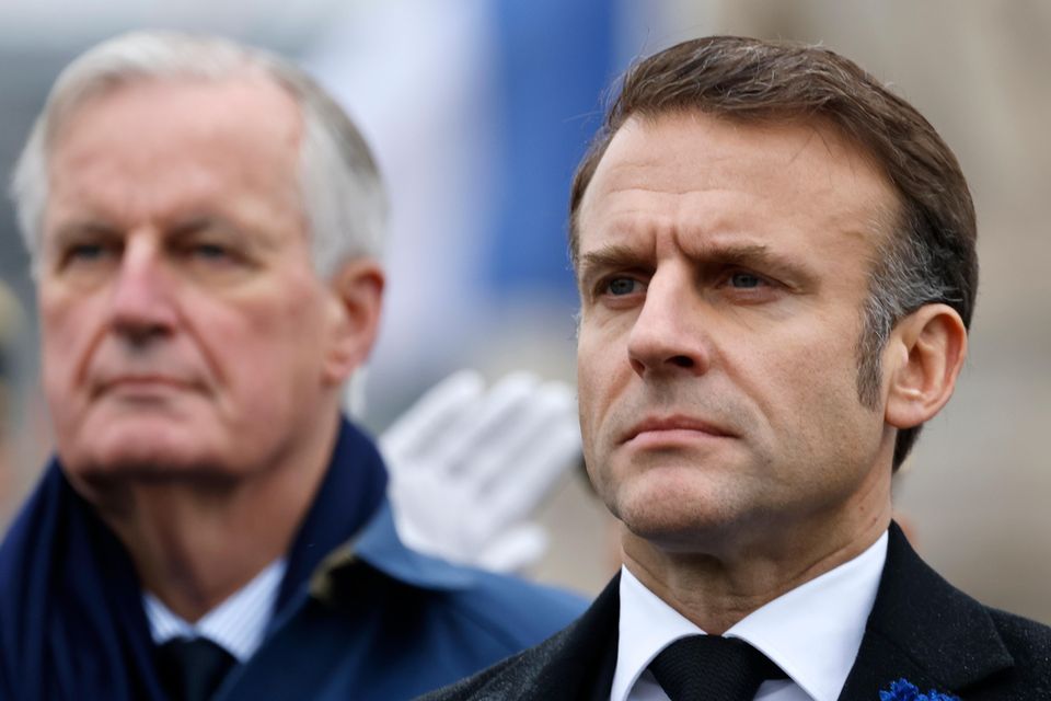 Emmanuel Macron, right, will remain France’s president ( Ludovic Marin, Pool via AP, File)