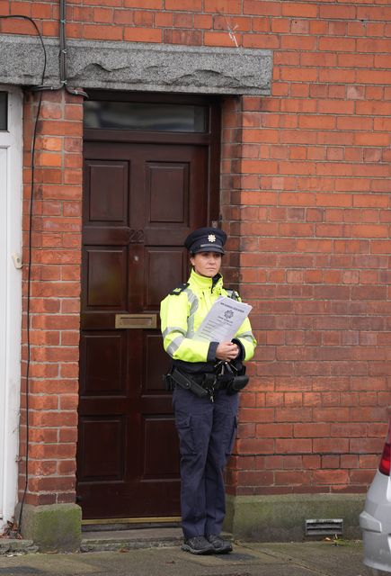 Gardai outside a house in Dundalk, Co Louth as they search a former family home in the investigation into the suspected murder of eight-year-old Kyran Durnin (Niall Carson/PA)