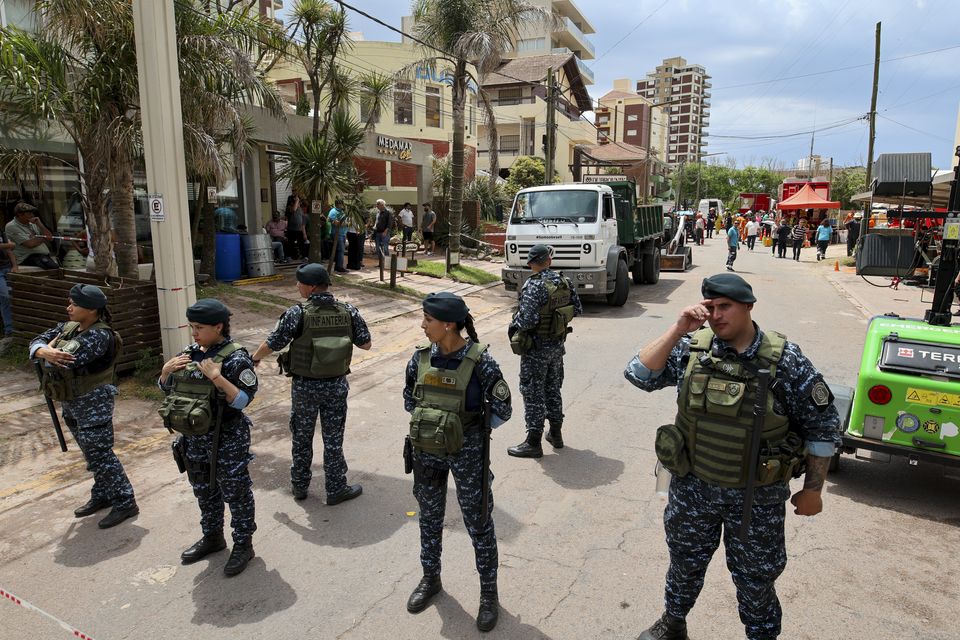 Police block a street leading to the Dubrovnik Hotel in Villa Gesell, Argentina (Christian Heit/AP)