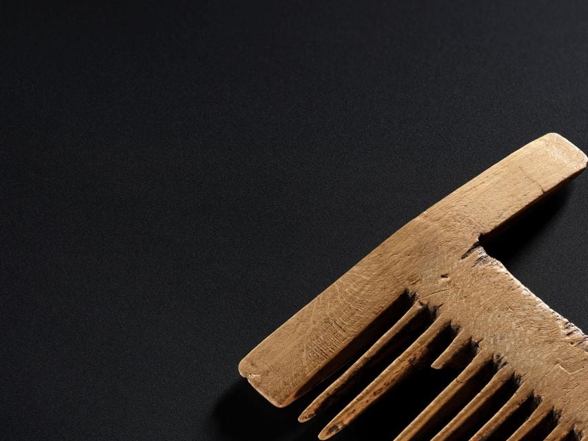 A wooden comb was found with the body (National Museums Scotland/PA)