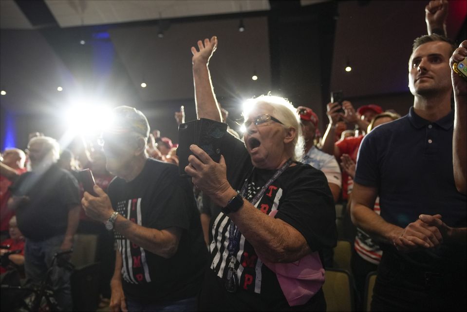 Supporters cheer as Donald Trump speaks at a campaign event in Prairie du Chien (Morry Gash/AP/PA)