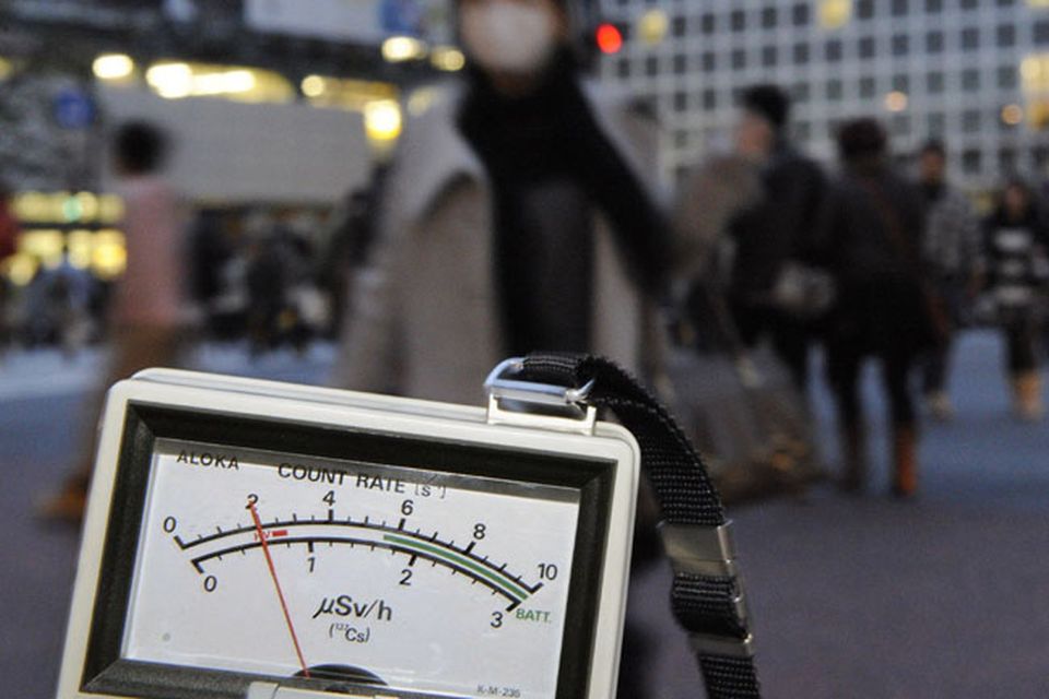 A radiation detector is used near Shibuya train station in Tokyo