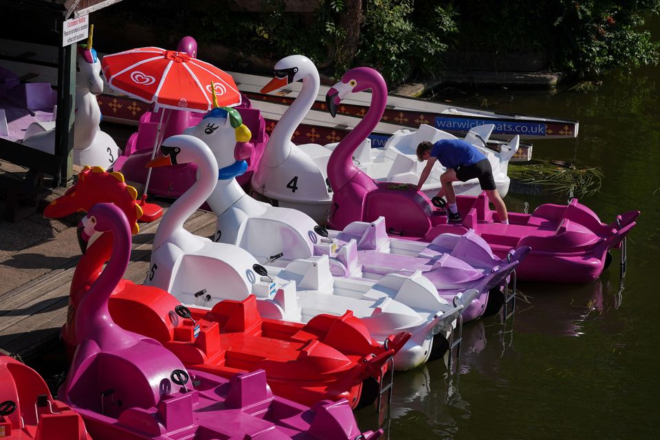 Staff at Warwick Boats prepare and clean pedalos during their busiest time of the year (Jacob King/PA)