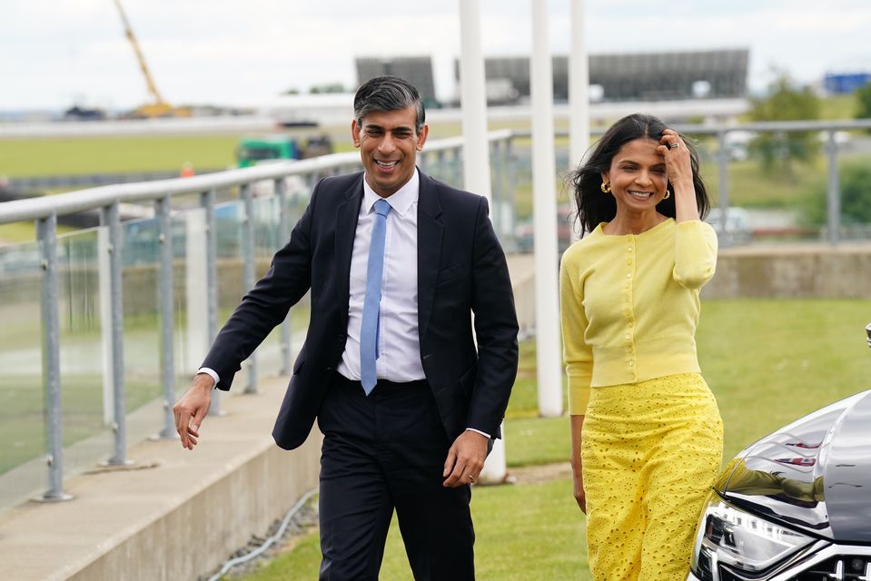 Rishi Sunak and wife Akshata Murty arrive for the launch of the Conservative Party General Election manifesto at Silverstone in Towcester, Northamptonshire (James Manning/PA)