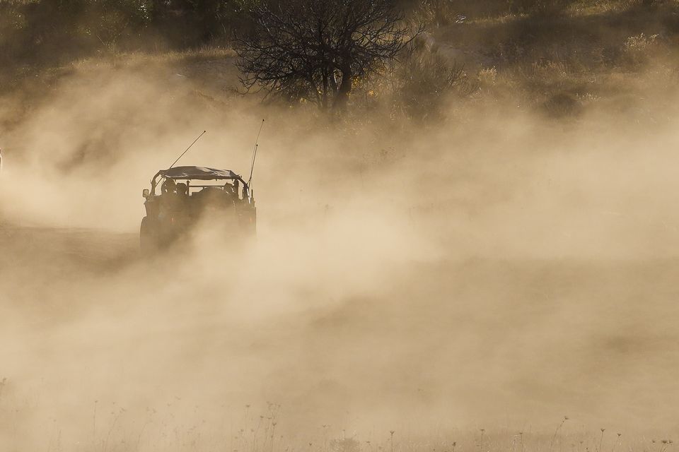 An Israeli armoured vehicle crosses the security fence moving towards the so-called Alpha Line that separates the Israeli-controlled Golan Heights from Syria (Matias Delacroix/AP)