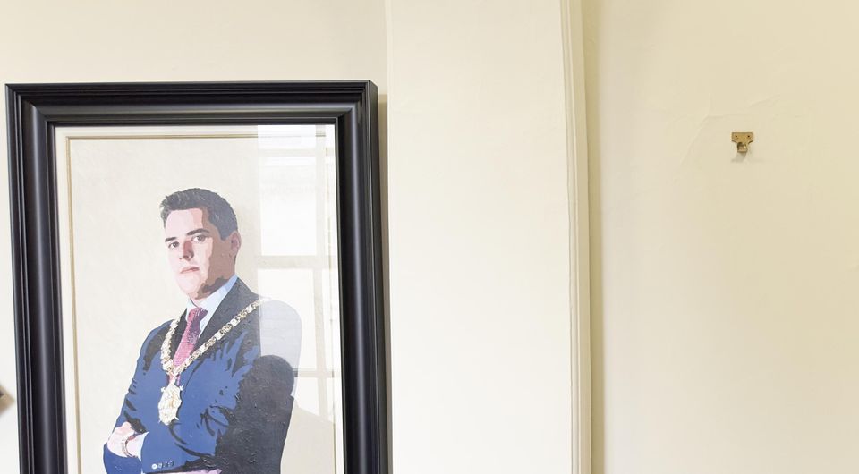 The empty space on the wall of Belfast City Hall, where the lord mayoral portrait of Niall O Donnghaile had hung (Liam McBurney/PA)