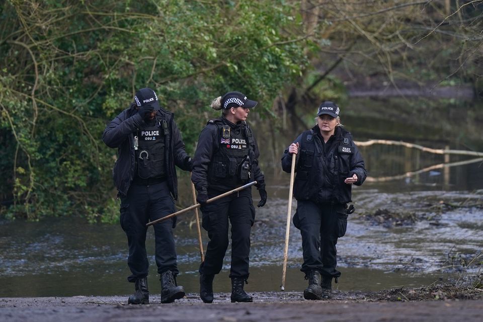 Police at the scene near Scribers Lane (Jacob King/PA)