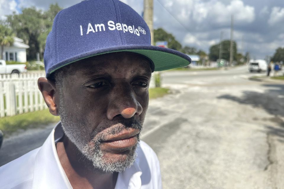 Jazz Watts, a resident of Sapelo Island, wears a hat that reads I am Sapelo (Russ Bynum/AP)