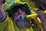 thumbnail: BELO HORIZONTE, BRAZIL - JUNE 23:  A fan of the Brazilian football team prepares to watch their match against Cameroon in the FIFA Fan Fest on June 23, 2014 in Belo Horizonte, Brazil. Brazil, the host nation of the 2014 FIFA World Cup, finished top of Group A which results in a fixture against Chile in the 'Round of 16'. (Photo by Oli Scarff/Getty Images)