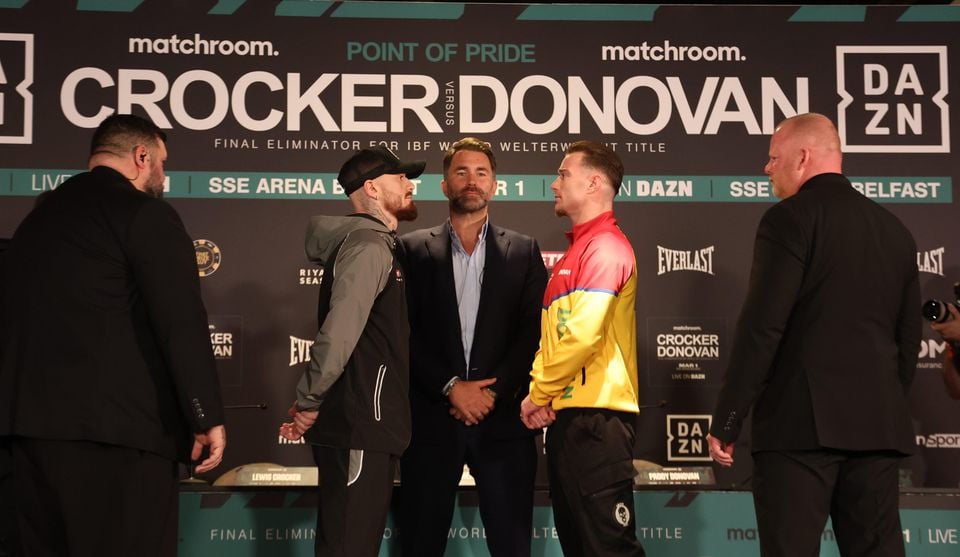 Lewis Crocker and Paddy Donovan stare each other down as promoter Eddie Hearn looks on