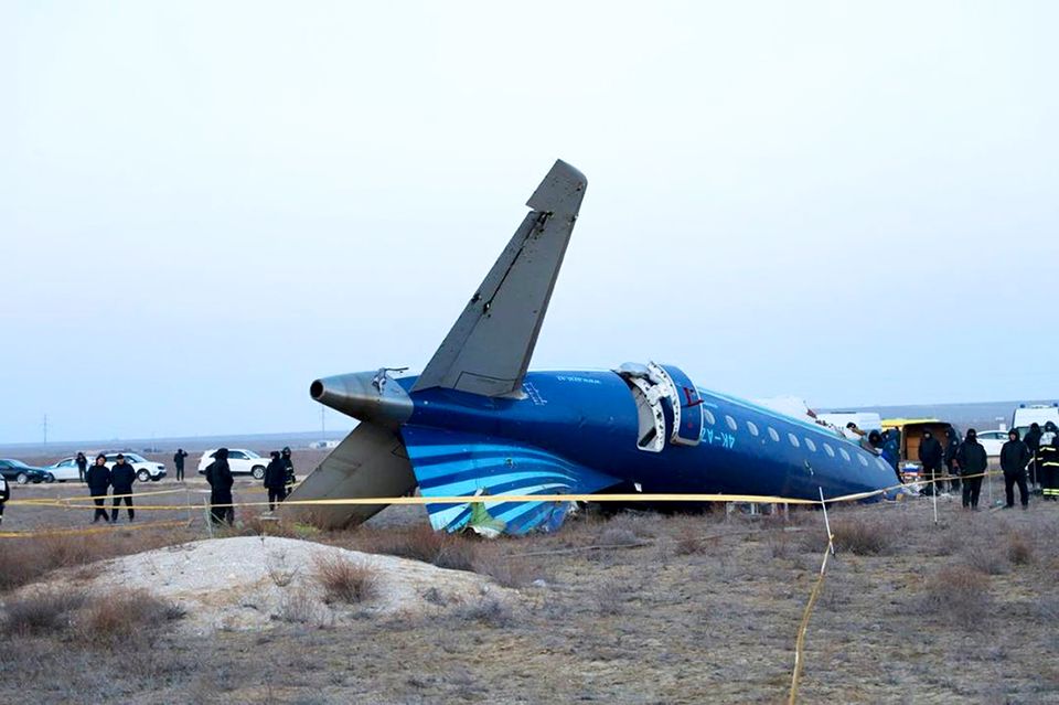 Part of the Azerbaijan Airlines Embraer 190 lies on the ground near the airport in Aktau, Kazakhstan (Administration of Mangystau Region/AP)