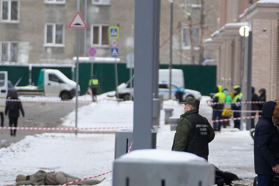 Investigators work at the site of the explosion (AP)