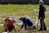 thumbnail: Britain's Prince Charles, Prince of Wales (L) and BurrenBeo Trust Project Manager Brendan Dunford (C) examine the flora during his visit to the Burren, a vast area of limestone rock, at Burren National Park in west Ireland, on May 19, 2015. Prince Charles on Tuesday became the first British royal to meet Irish republican leader Gerry Adams, on a visit that will take him to the scene of his great-uncle's murder by the IRA.  AFP PHOTO / POOL / JOHN STILLWELLJOHN STILLWELL/AFP/Getty Images