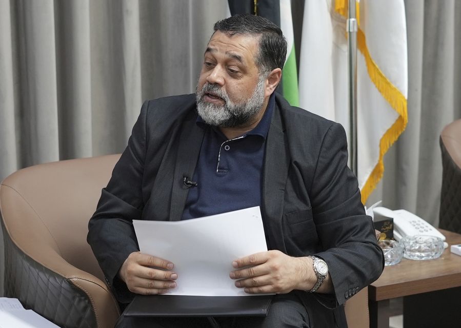 Hamas political official Osama Hamdan speaks during an interview (Malak Harb/AP)