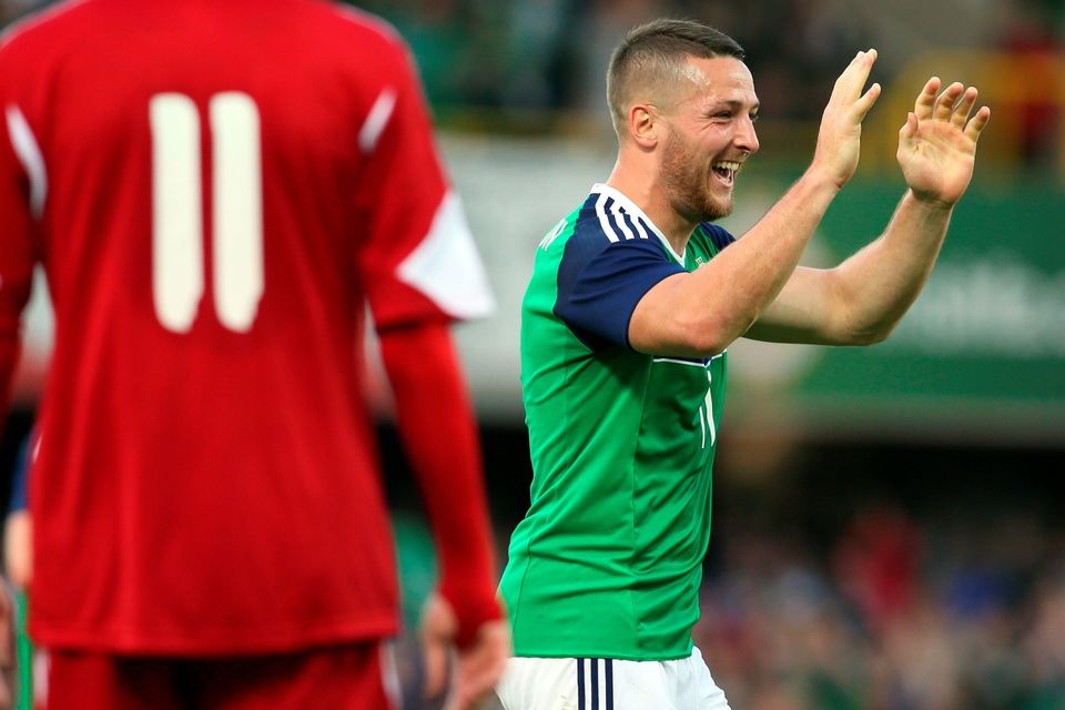 Northern Ireland's Conor Washington (R) celebrates after scoring the team's second goal against Belarus during an international friendly football match between Northern Ireland and Belarus at Windsor Park in Belfast, Northern Ireland, on May 27, 2016. / AFP PHOTO / PAUL FAITHPAUL FAITH/AFP/Getty Images