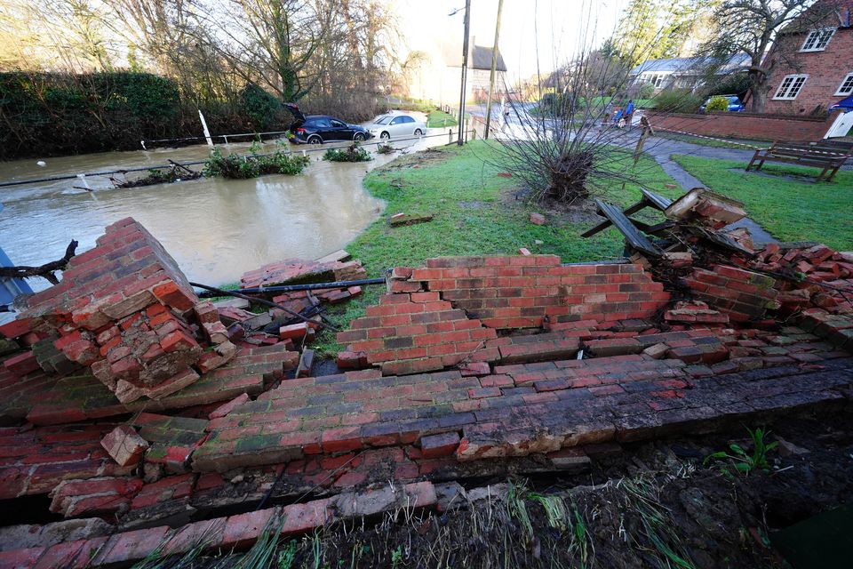 The strength of the water knocked down a wall (Mike Egerton/PA)