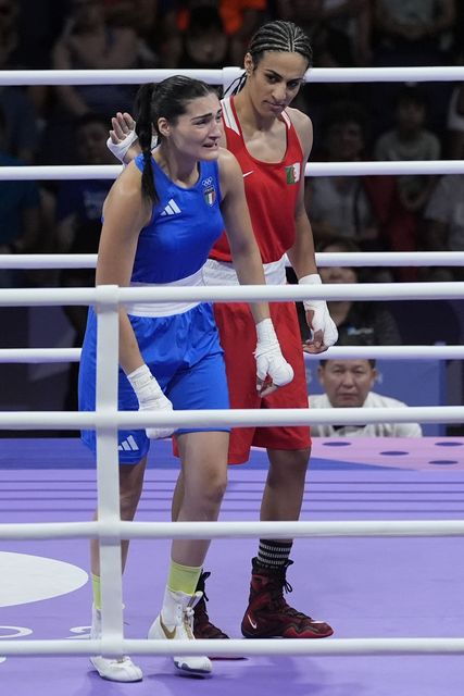 Algeria’s Imane Khelif (red) next to Italy’s Angela Carini at the end of their women’s boxing match (John Locher/AP)