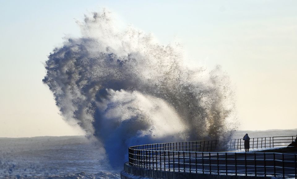 Huge waves smash against the sea front at Whitley Bay in North Tyneside (Owen Humphreys/PA)