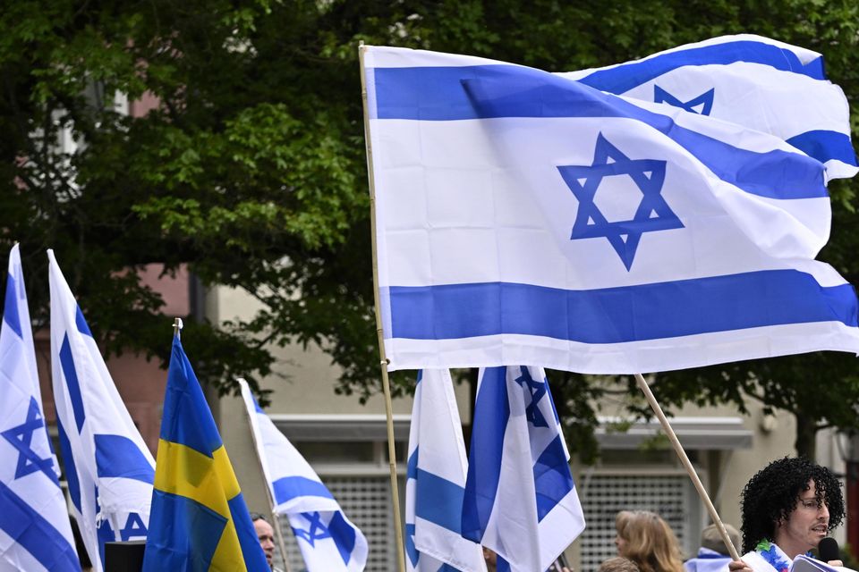 People carry Israeli and Swedish flags during a pro-Israel demonstration to pay tribute to Israel’s Eurovision participant Eden Golan in Malmo, Sweden (Johan Nilsson/TT News Agency via AP)