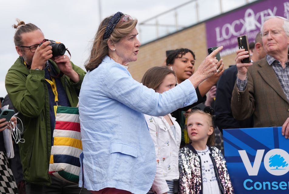 GP and Tory member Jane Lees-Millais (centre) heckles Prime Minister Rishi Sunak during a visit to Melksham Town Football Club, during the General Election campaign trail (Jacob King/PA)