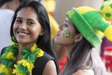 thumbnail: The beautiful game - football fans from around the world -   Fans of the Brazilian football team arrive to watch a match on a giant screen in the 'Fan Fest' area in Porta Negro on June 17, 2014 in Manaus, Brazil. Brazil, the host nation of the 2014 FIFA World Cup, are due to play their second group match against Mexico in Fortaleza today.  (Photo by Oli Scarff/Getty Images)